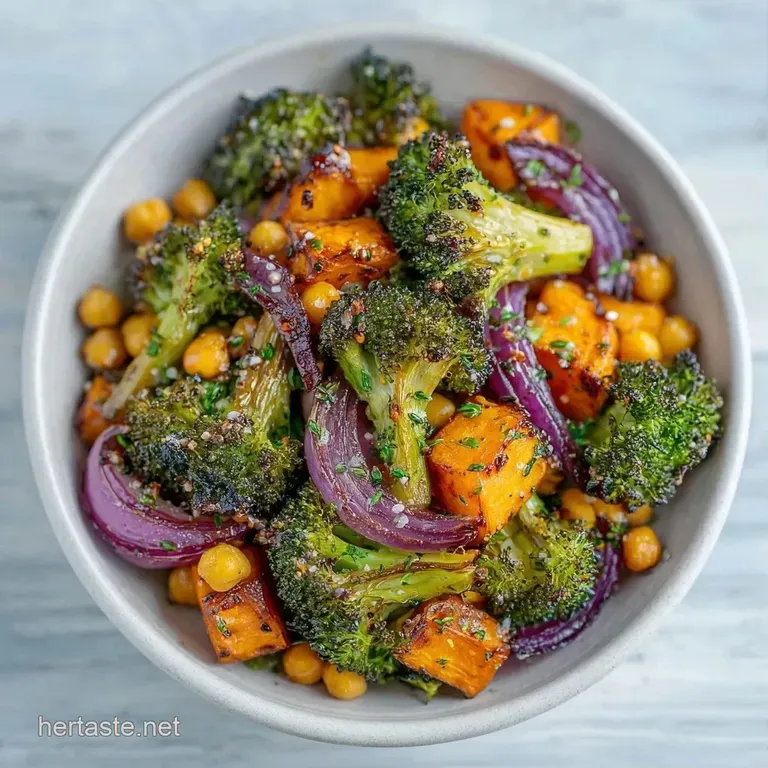 A white ceramic plate holding a vibrant medley of roasted carrots, zucchini, and red onions with a drizzle of oil.